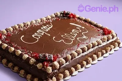 Chocolate rectangle sheet cake with white piped icing message and decorative chocolate and cream rosettes around the border. Chocolate rectangle sheet cake with white piped icing message and decorative chocolate and cream rosettes around the border.