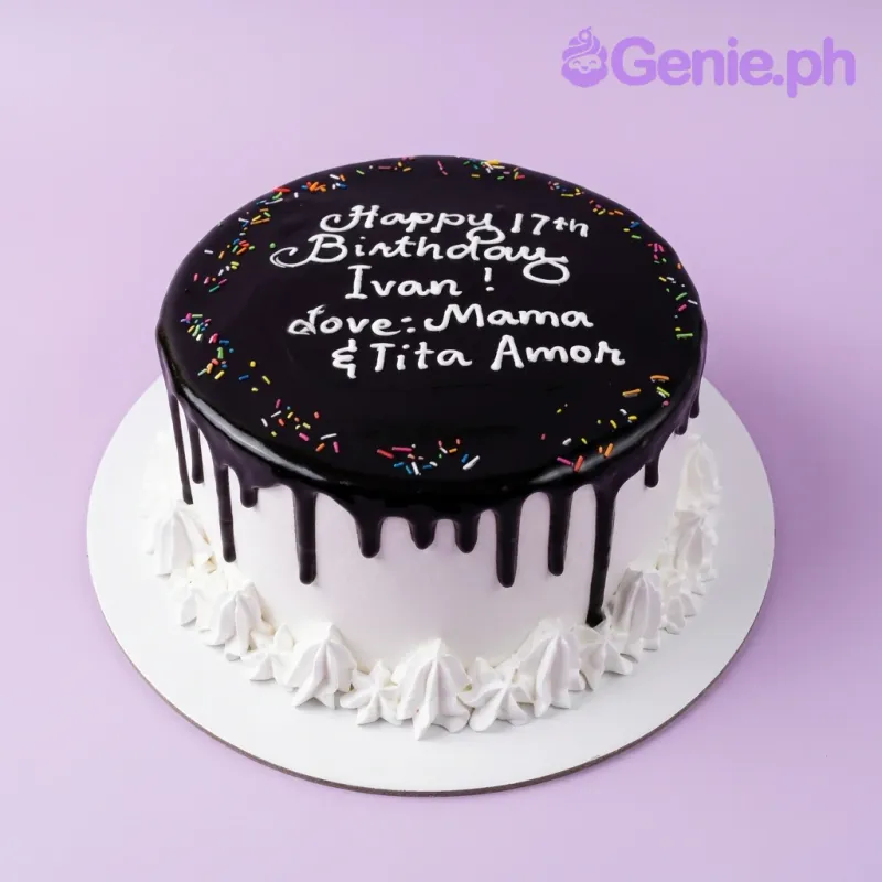 A white 1-tier birthday cake with dark chocolate drip, colorful sprinkles, white icing rosettes, and personalized text. A white 1-tier birthday cake with dark chocolate drip, colorful sprinkles, white icing rosettes, and personalized text.
