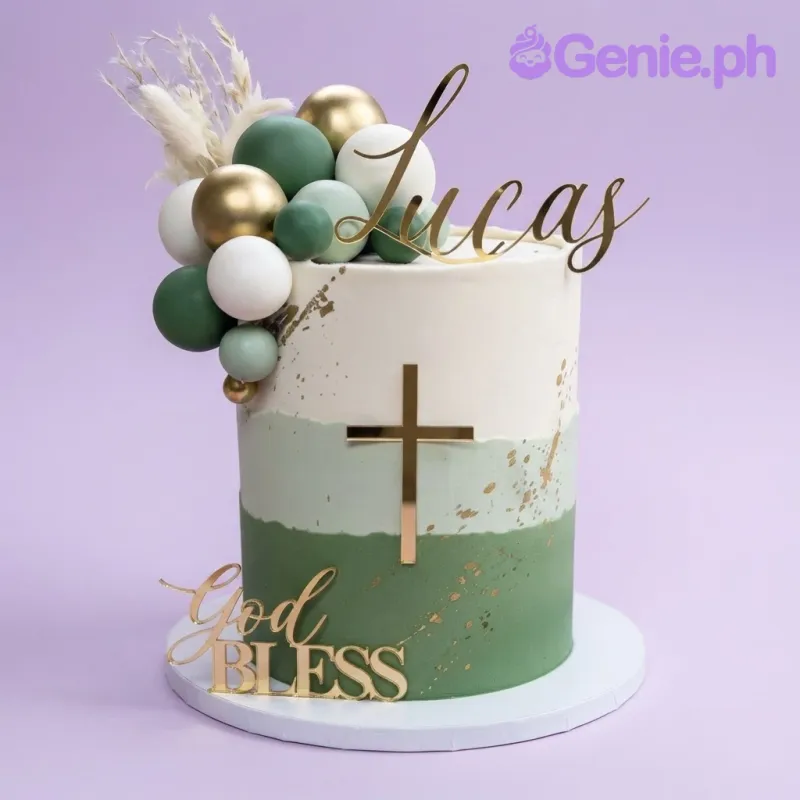 A tall 1-tier cake with a white to green gradient icing, gold cross topper, and green and gold sphere decorations A tall 1-tier cake with a white to green gradient icing, gold cross topper, and green and gold sphere decorations