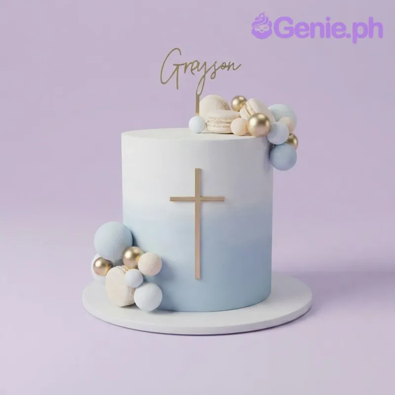 Light blue and white gradient 1-tier christening cake with a gold cross, spheres, macarons, and name topper Light blue and white gradient 1-tier christening cake with a gold cross, spheres, macarons, and name topper