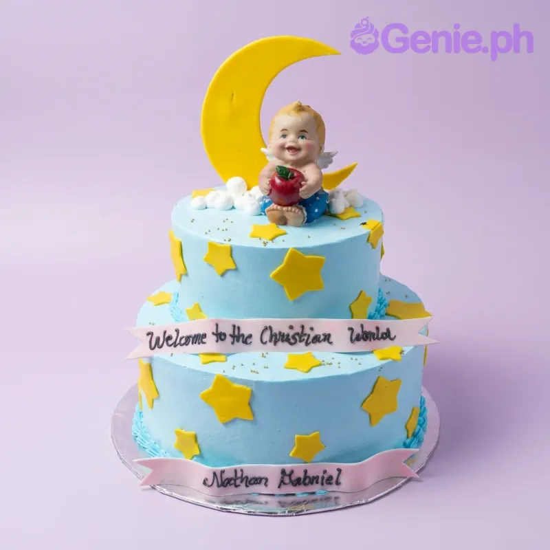 Two-tier light blue baptism cake with a large yellow crescent moon, a baby angel figurine, and yellow fondant stars. Two-tier light blue baptism cake with a large yellow crescent moon, a baby angel figurine, and yellow fondant stars.