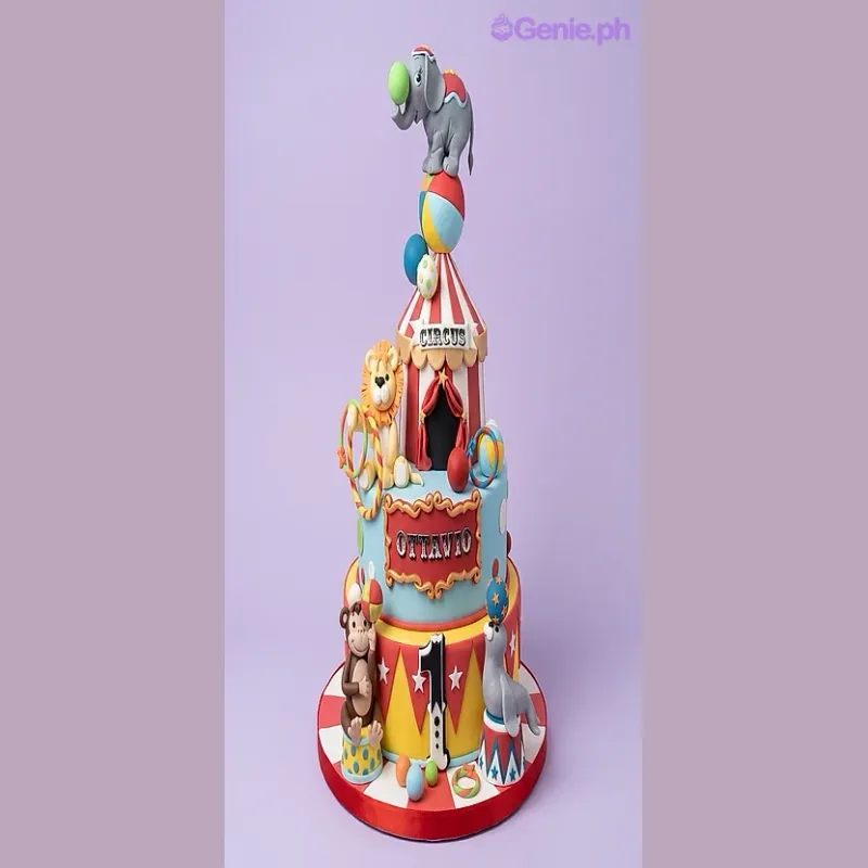 2-tier circus themed fondant cake with elephant, lion, monkey, and seal animal toppers 2-tier circus themed fondant cake with elephant, lion, monkey, and seal animal toppers