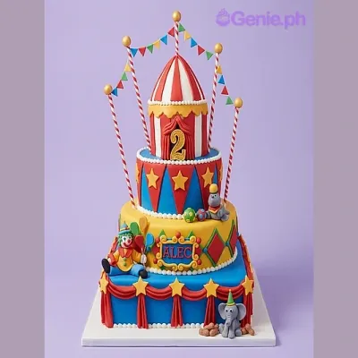 3-tier circus themed fondant cake with clown, elephant, and seal figurines and a tent topper 3-tier circus themed fondant cake with clown, elephant, and seal figurines and a tent topper
