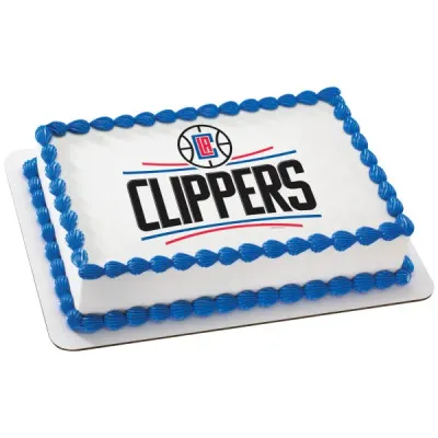 A white rectangle cake themed around Clippers Basketball, featuring a large Los Angeles Clippers logo printout and blue shell piped borders. A white rectangle cake themed around Clippers Basketball, featuring a large Los Angeles Clippers logo printout and blue shell piped borders.