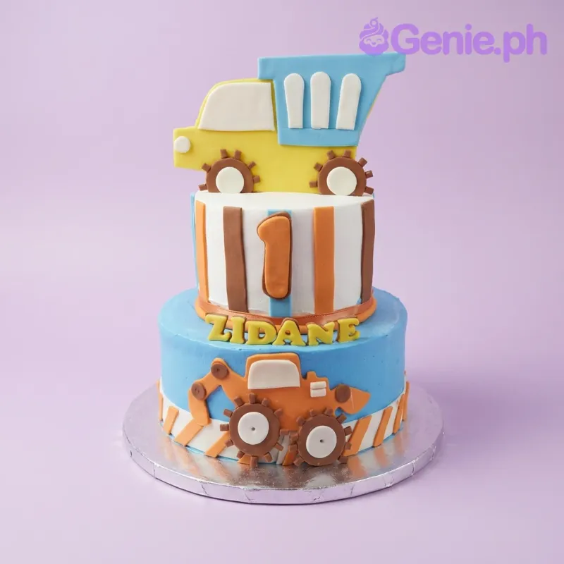 Two-tier construction themed birthday cake with blue and white fondant, featuring a yellow dump truck topper and orange excavator decoration. Two-tier construction themed birthday cake with blue and white fondant, featuring a yellow dump truck topper and orange excavator decoration.