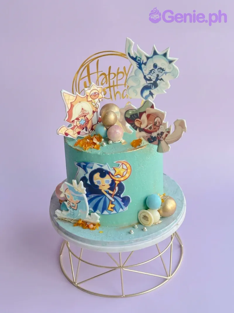 A teal 1 Tier cake themed around Cookie Run Kingdom, featuring character printouts, a gold Happy Birthday topper, and gold spheres. A teal 1 Tier cake themed around Cookie Run Kingdom, featuring character printouts, a gold Happy Birthday topper, and gold spheres.