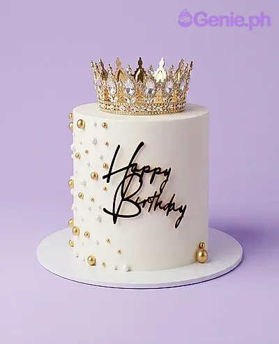 White 1-tier birthday cake with gold rhinestone crown topper and gold and white sphere decorations White 1-tier birthday cake with gold rhinestone crown topper and gold and white sphere decorations
