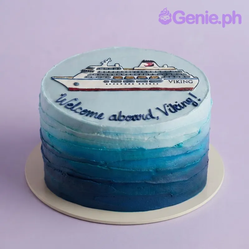 Light blue ombre 1-tier soft icing cake with a flat fondant cruise ship topper and blue piped lettering Light blue ombre 1-tier soft icing cake with a flat fondant cruise ship topper and blue piped lettering