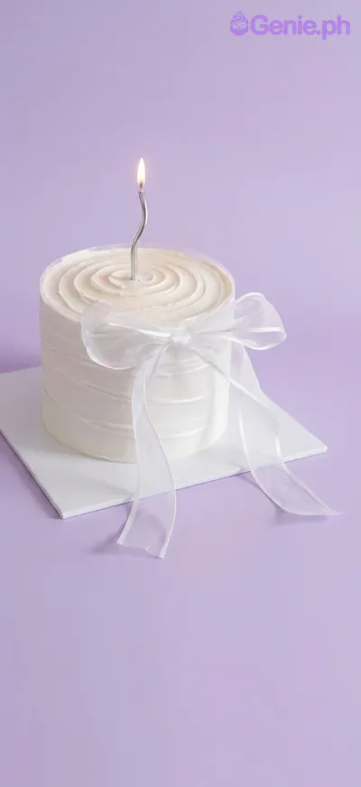 A white 2 Tier Fondant cake themed around a wedding, featuring a 'Mr & Mrs Seth' topper and dark blue and white edible roses. A white 2 Tier Fondant cake themed around a wedding, featuring a 'Mr & Mrs Seth' topper and dark blue and white edible roses.