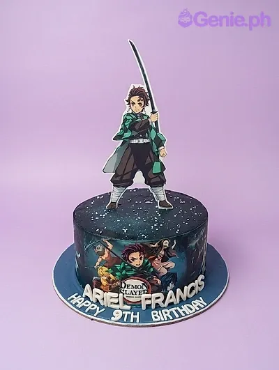 Demon Slayer Tanjiro Kamado themed birthday cake with character printouts and edible photo wrap on dark blue icing. Demon Slayer Tanjiro Kamado themed birthday cake with character printouts and edible photo wrap on dark blue icing.
