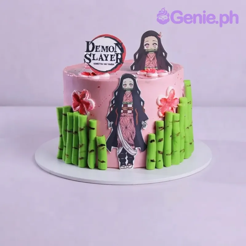 Light pink 1-tier cake with soft icing, Demon Slayer theme, a Nezuko bust topper, and green bamboo stalks Light pink 1-tier cake with soft icing, Demon Slayer theme, a Nezuko bust topper, and green bamboo stalks