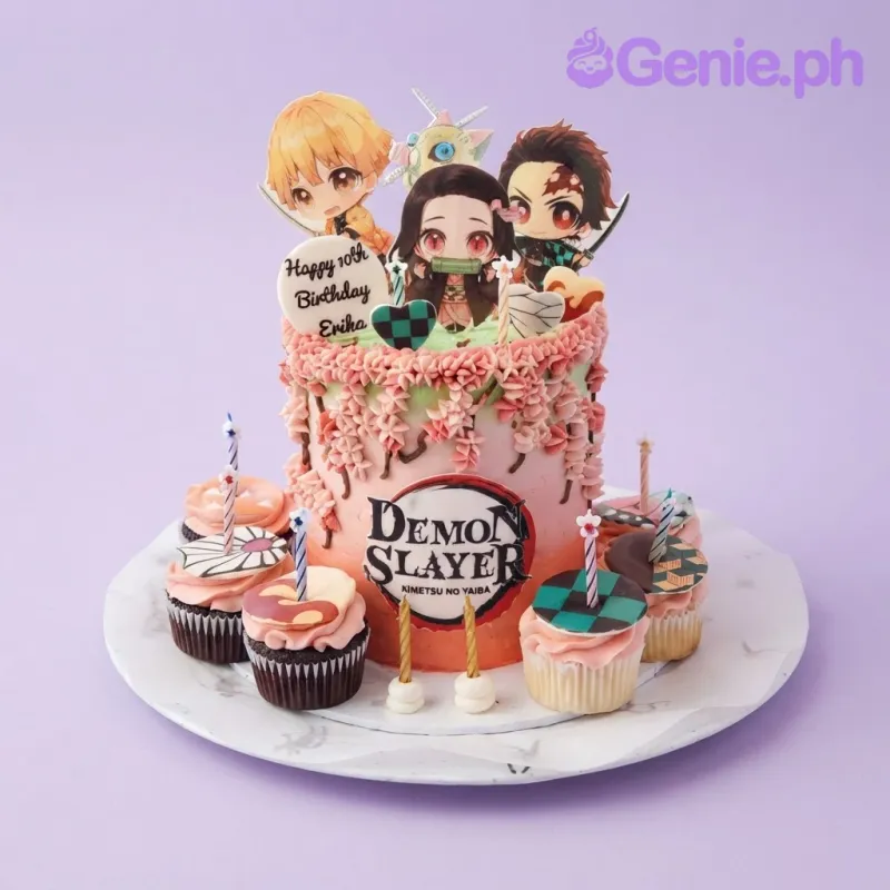 Pink and green single tier cake with soft icing, Demon Slayer theme, character printouts, and piped flowers Pink and green single tier cake with soft icing, Demon Slayer theme, character printouts, and piped flowers