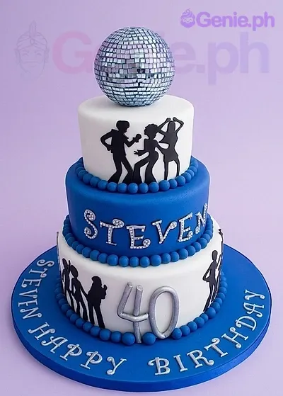 A blue and white 3-tier fondant Disco cake, featuring silver disco ball, silver 40, and black dancing silhouettes. A blue and white 3-tier fondant Disco cake, featuring silver disco ball, silver 40, and black dancing silhouettes.
