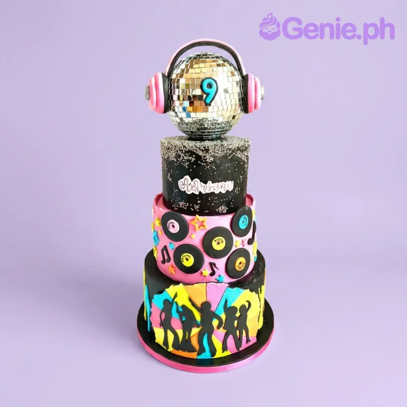 A black 3-tier fondant Disco Party cake, featuring disco ball, headphones, number 9, records, and dancers. A black 3-tier fondant Disco Party cake, featuring disco ball, headphones, number 9, records, and dancers.