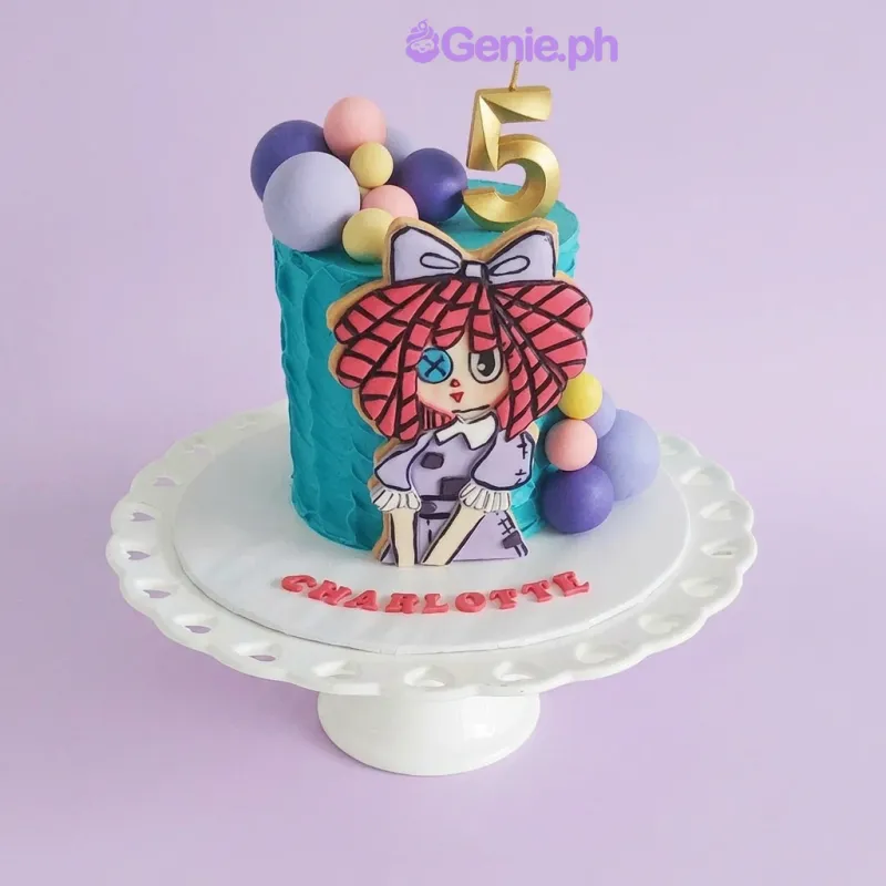 Blue 1-tier birthday cake with a doll character printout, number 5 candle, and colorful fondant spheres Blue 1-tier birthday cake with a doll character printout, number 5 candle, and colorful fondant spheres