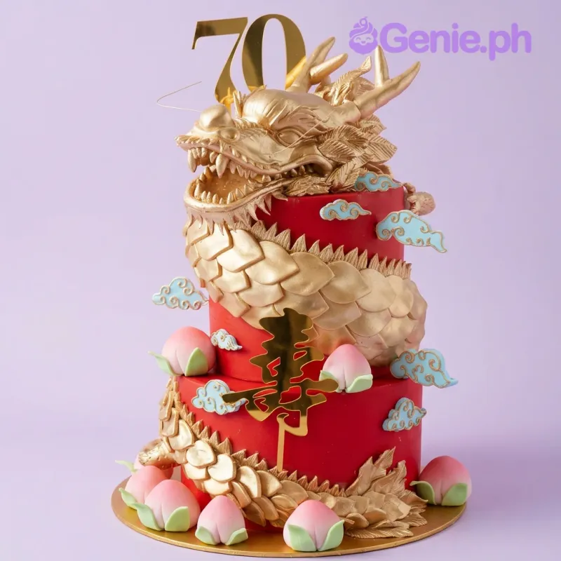 Red 2-tier fondant cake with a large gold dragon sculpture, gold number 70 topper, and fondant peach accents Red 2-tier fondant cake with a large gold dragon sculpture, gold number 70 topper, and fondant peach accents