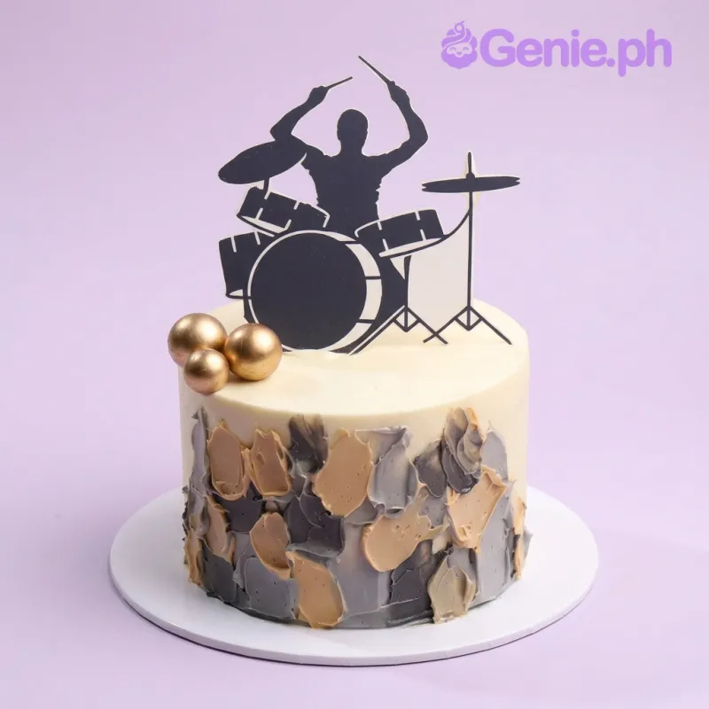 White 1-tier cake with a black drummer silhouette topper and gold spheres White 1-tier cake with a black drummer silhouette topper and gold spheres