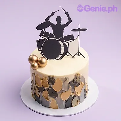 One tier cake with a drummer silhouette printout, gold spheres, and palette knife texture One tier cake with a drummer silhouette printout, gold spheres, and palette knife texture