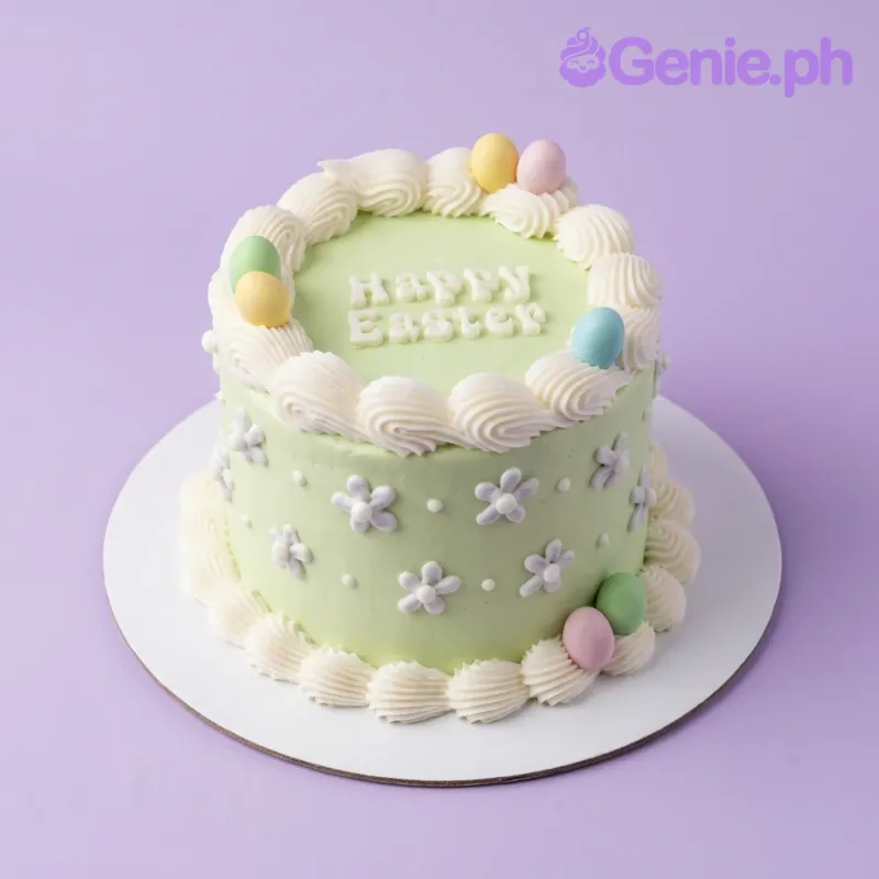 A light green and white 1-tier cake themed around Easter, featuring pastel colored eggs, white piped borders, and purple icing flowers. A light green and white 1-tier cake themed around Easter, featuring pastel colored eggs, white piped borders, and purple icing flowers.