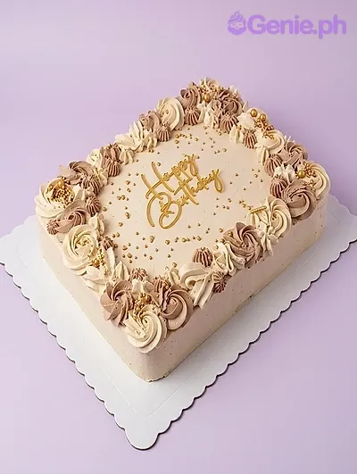 A beige and brown rectangular cake themed around Elegant Beige, featuring a gold 'Happy Birthday' script topper, beige and brown rosettes, and gold sprinkles. A beige and brown rectangular cake themed around Elegant Beige, featuring a gold 'Happy Birthday' script topper, beige and brown rosettes, and gold sprinkles.