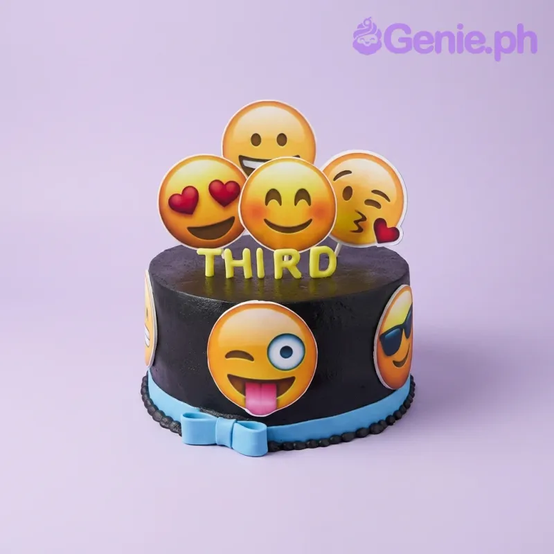 A black 1 Tier cake themed Emoji, with yellow gumpaste letters 'THIRD', emoji printout toppers, and a blue fondant ribbon. A black 1 Tier cake themed Emoji, with yellow gumpaste letters 'THIRD', emoji printout toppers, and a blue fondant ribbon.
