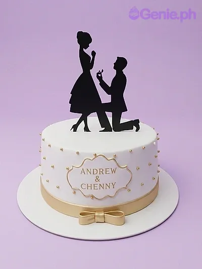 A white 1-tier cake themed around engagement, featuring a black silhouette couple topper and gold accents. A white 1-tier cake themed around engagement, featuring a black silhouette couple topper and gold accents.