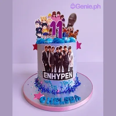 Purple 1-tier birthday cake with Enhypen K-pop band printout toppers and blue icing swirls Purple 1-tier birthday cake with Enhypen K-pop band printout toppers and blue icing swirls