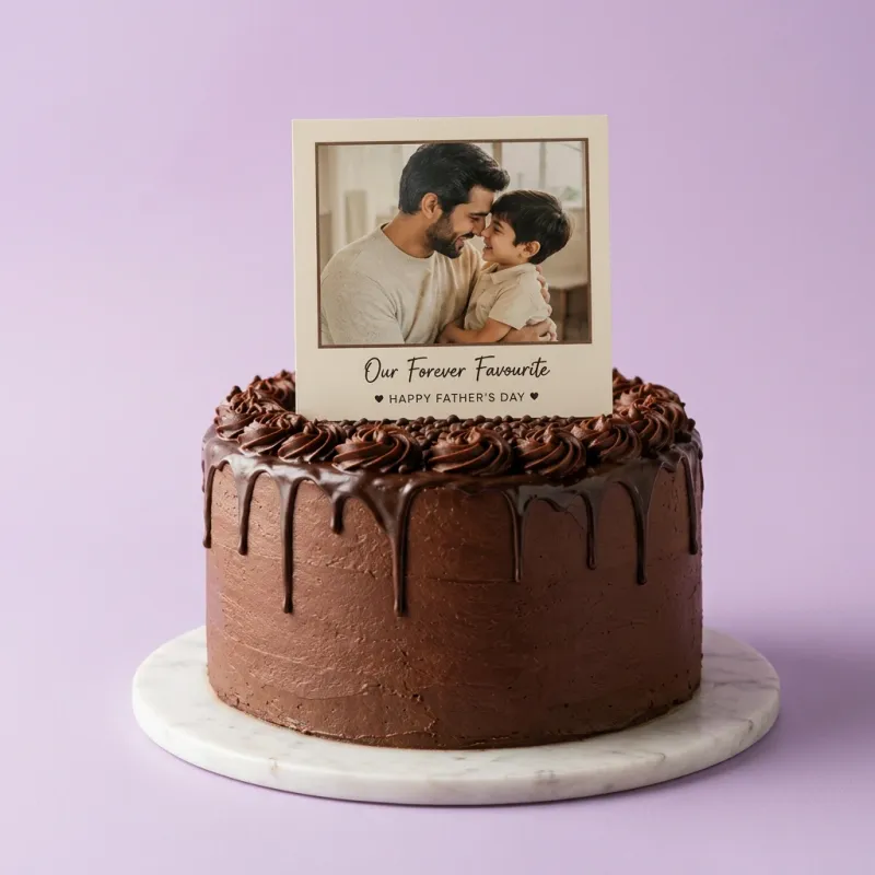 Chocolate drip cake for Father's Day featuring a photo printout of a father and son with chocolate icing rosettes and sprinkles. Chocolate drip cake for Father's Day featuring a photo printout of a father and son with chocolate icing rosettes and sprinkles.