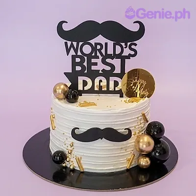 White textured icing cake for Father's Day with black mustache toppers and gold and black decorative spheres. White textured icing cake for Father's Day with black mustache toppers and gold and black decorative spheres.