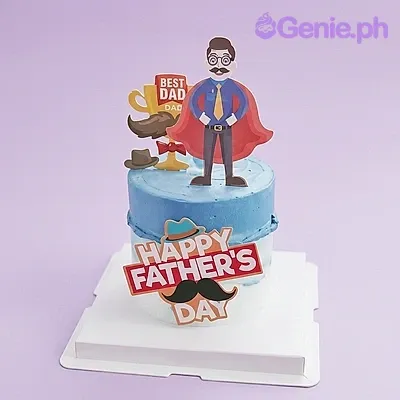 Light blue single tier cake for Father's Day with a superhero dad printout topper and a Happy Father's Day message Light blue single tier cake for Father's Day with a superhero dad printout topper and a Happy Father's Day message