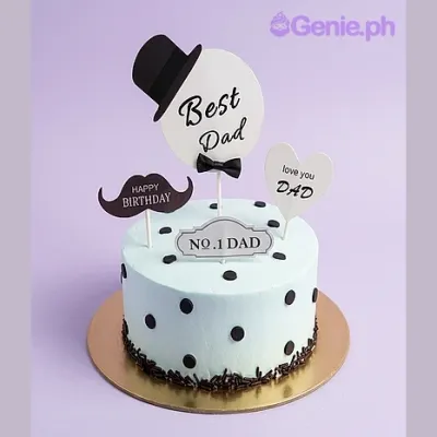 White 1-tier cake for Father's Day with printed Best Dad and mustache toppers and black icing polka dots White 1-tier cake for Father's Day with printed Best Dad and mustache toppers and black icing polka dots