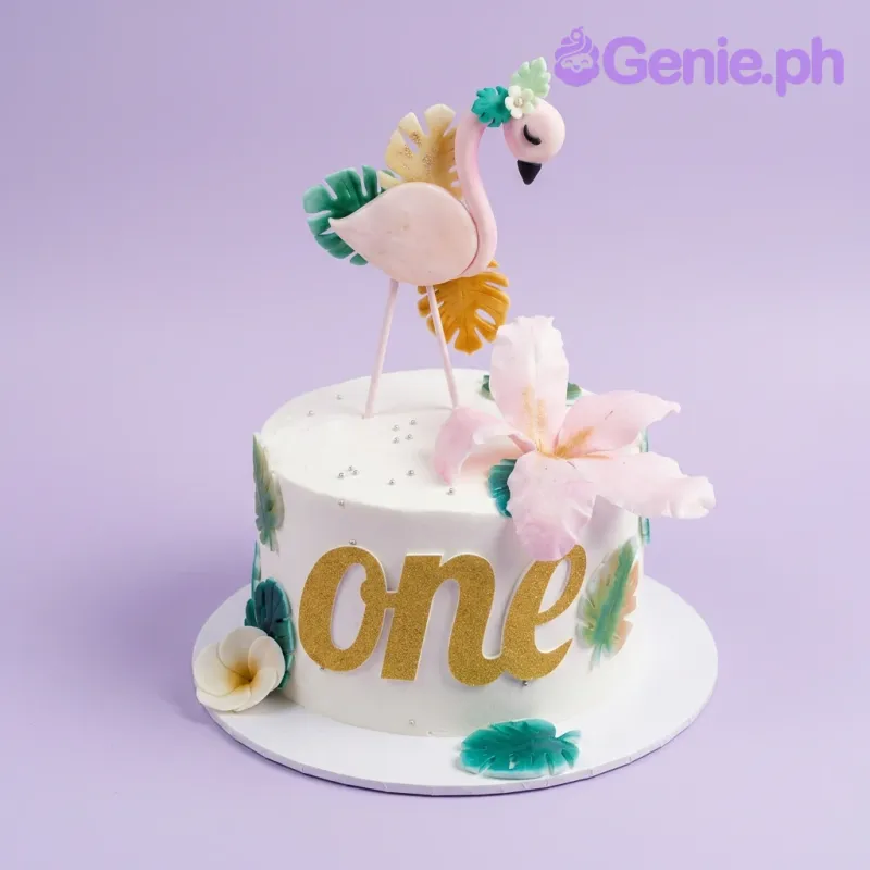A white and pink 1-tier cake themed around Flamingo, featuring a pink flamingo, a gold 'one' topper, pink hibiscus, and tropical leaves. A white and pink 1-tier cake themed around Flamingo, featuring a pink flamingo, a gold 'one' topper, pink hibiscus, and tropical leaves.