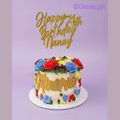 White 1-tier birthday cake with colorful piped icing flowers and gold glitter Happy 74th Birthday Nanay topper White 1-tier birthday cake with colorful piped icing flowers and gold glitter Happy 74th Birthday Nanay topper