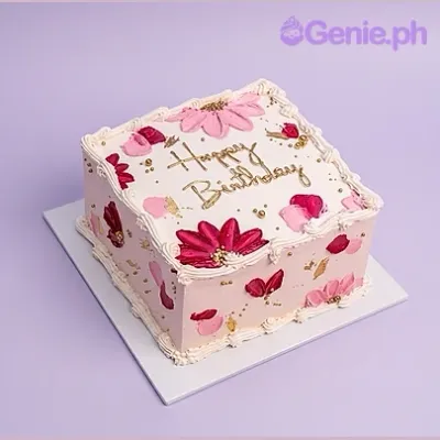 Square birthday cake with pink and dark red flowers and gold sprinkles Square birthday cake with pink and dark red flowers and gold sprinkles