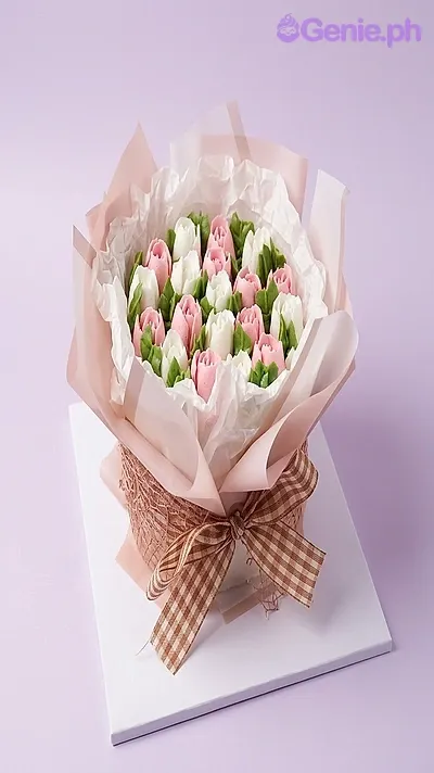 A Pink and White 1 Tier cake themed around Floral Bouquet, featuring pink and white icing roses and a brown checkered ribbon. A Pink and White 1 Tier cake themed around Floral Bouquet, featuring pink and white icing roses and a brown checkered ribbon.
