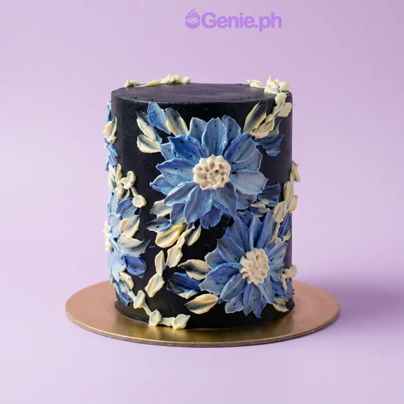Black 1-tier cake with blue and white palette knife painted buttercream flowers Black 1-tier cake with blue and white palette knife painted buttercream flowers