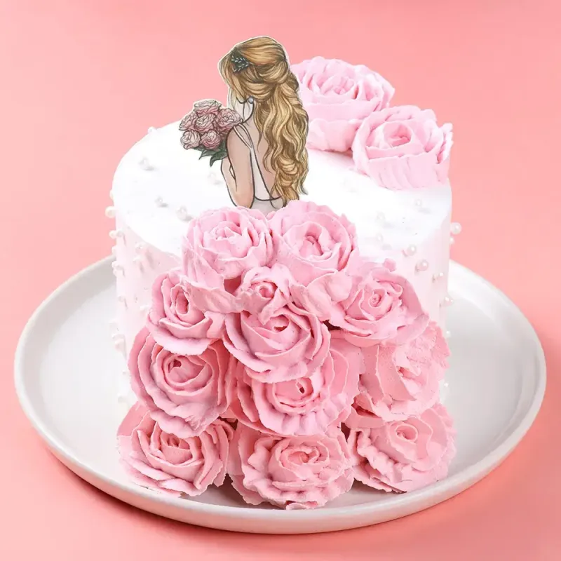 White 1-tier cake with soft icing, a girl printout topper, and a cascade of piped pink icing roses White 1-tier cake with soft icing, a girl printout topper, and a cascade of piped pink icing roses