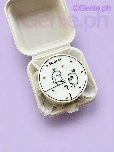 A white bento cake themed around Flork, featuring a Flork character printout, red hearts, and personalized black text. A white bento cake themed around Flork, featuring a Flork character printout, red hearts, and personalized black text.