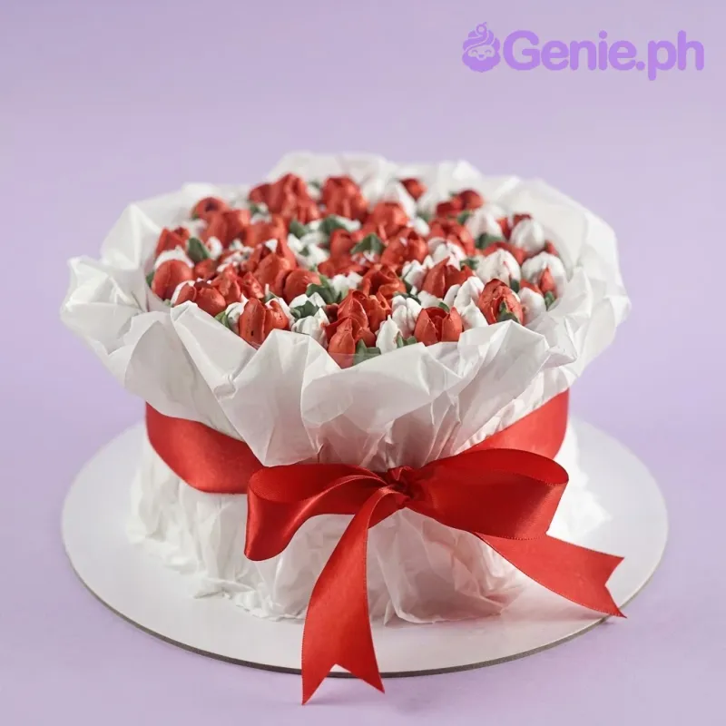 White 1-tier soft icing cake designed as a flower bouquet with a dense red piped flower top and red ribbon White 1-tier soft icing cake designed as a flower bouquet with a dense red piped flower top and red ribbon