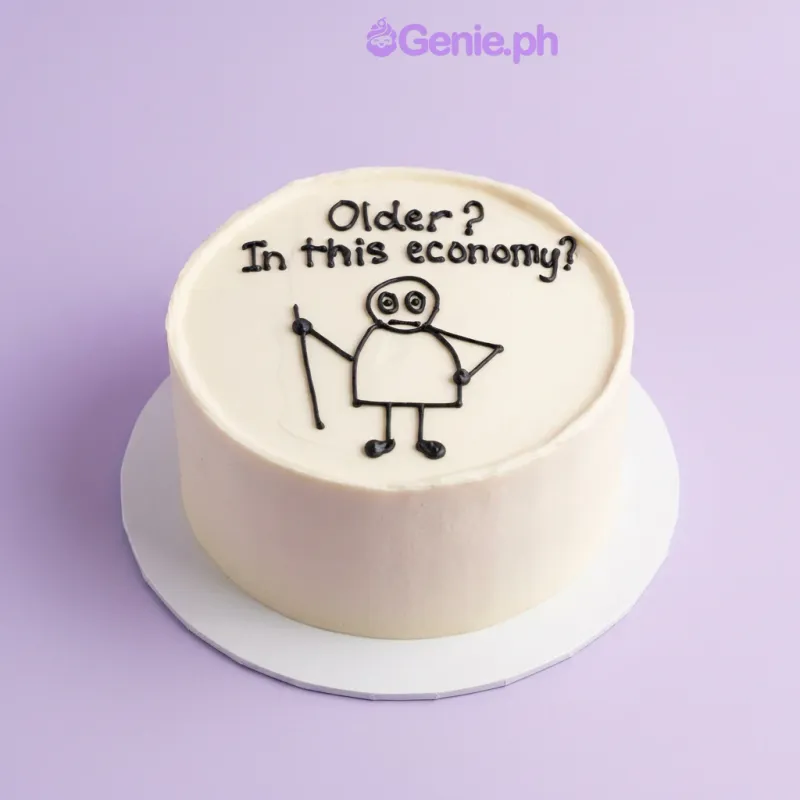 White bento cake with black piped text Older In this economy and a stick figure drawing White bento cake with black piped text Older In this economy and a stick figure drawing