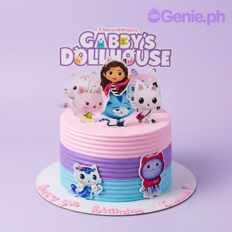 A pink, purple, and light blue 1-tier cake themed Gabby's Dollhouse, featuring Gabby, cat characters, and horizontal icing ridges. A pink, purple, and light blue 1-tier cake themed Gabby's Dollhouse, featuring Gabby, cat characters, and horizontal icing ridges.