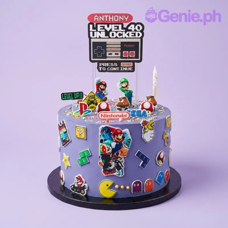 A purple 1-tier gaming cake featuring Mario, Luigi, an NES controller, and Mario Kart collage, with Pac-Man and gaming icons. A purple 1-tier gaming cake featuring Mario, Luigi, an NES controller, and Mario Kart collage, with Pac-Man and gaming icons.