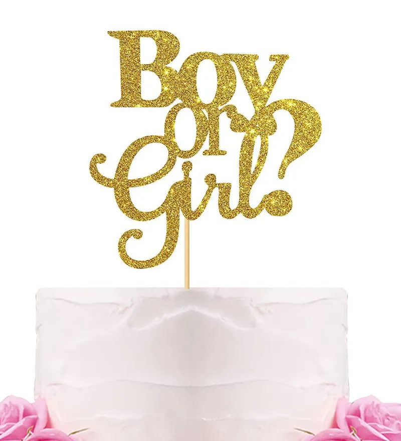A white 1-tier cake themed around Gender Reveal, featuring a large gold glitter 'Boy or Girl' topper and pink roses at the base. A white 1-tier cake themed around Gender Reveal, featuring a large gold glitter 'Boy or Girl' topper and pink roses at the base.