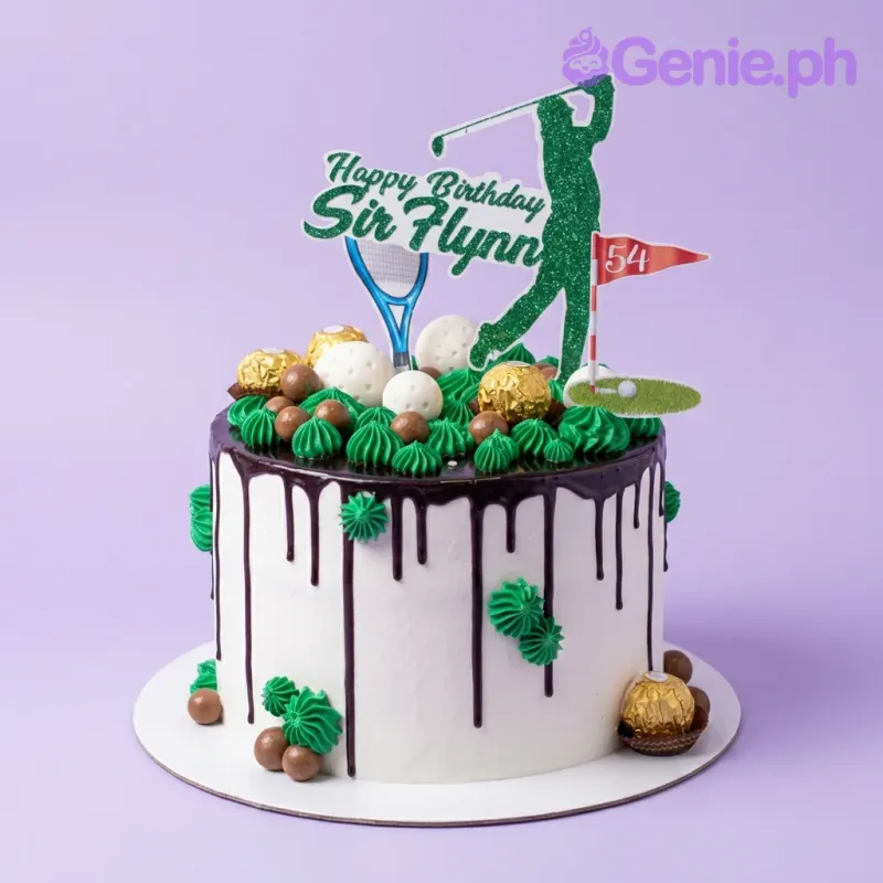 A white and green 1-tier Golf cake, featuring golfer silhouette, golf balls, chocolate drip, green rosettes. A white and green 1-tier Golf cake, featuring golfer silhouette, golf balls, chocolate drip, green rosettes.