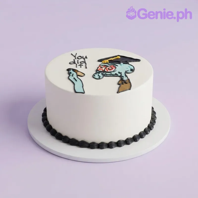 White round cake with a hand-piped icing doodle of Squidward wearing a graduation cap and the text You did it White round cake with a hand-piped icing doodle of Squidward wearing a graduation cap and the text You did it