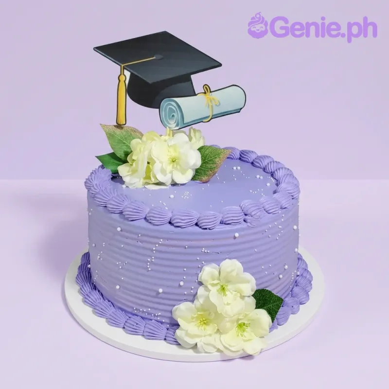 A purple 1 Tier cake themed around Graduation, featuring a black cap and diploma printout, white flowers, and silver sprinkles. A purple 1 Tier cake themed around Graduation, featuring a black cap and diploma printout, white flowers, and silver sprinkles.