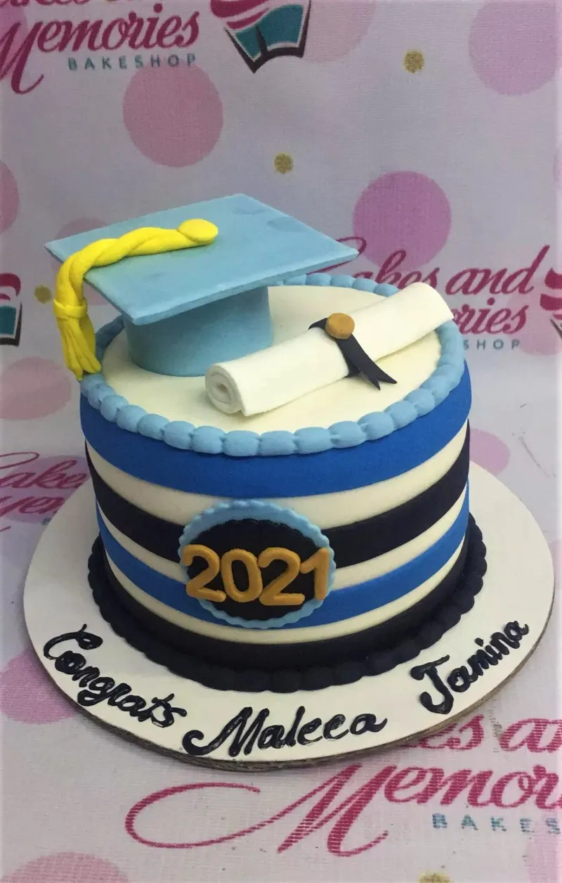 A blue and white 1 Tier Fondant cake themed around Graduation, featuring a fondant graduation cap, diploma, and 2021 year topper. A blue and white 1 Tier Fondant cake themed around Graduation, featuring a fondant graduation cap, diploma, and 2021 year topper.