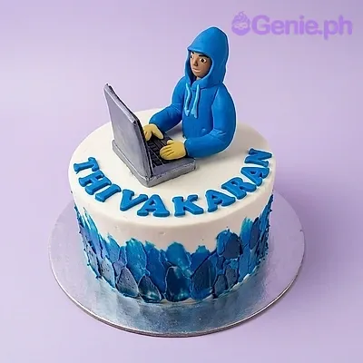 White and blue single-tier cake with a 3D fondant hacker figure and piped name White and blue single-tier cake with a 3D fondant hacker figure and piped name