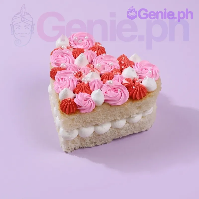 A white, pink, and red heart-shaped 1-tier cake featuring pink and red icing rosettes, white cream dollops, and white pearls. A white, pink, and red heart-shaped 1-tier cake featuring pink and red icing rosettes, white cream dollops, and white pearls.