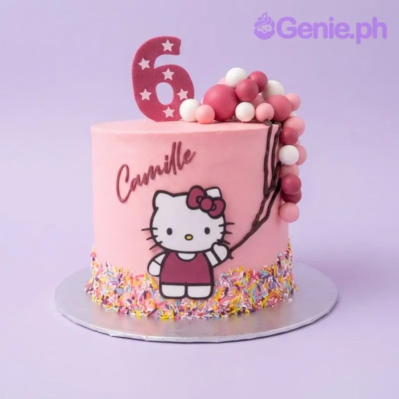 Light pink 1-tier cake with a Hello Kitty character cutout, a number six topper, and a cluster of pink and white balloon spheres Light pink 1-tier cake with a Hello Kitty character cutout, a number six topper, and a cluster of pink and white balloon spheres